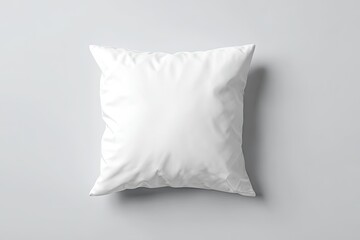 Obraz premium Blank white square pillow on a gray surface