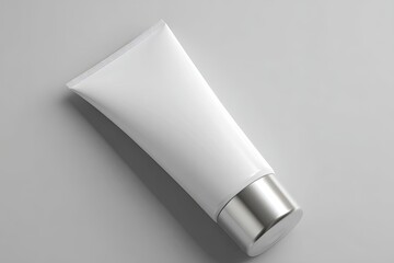 White cosmetic tube on light gray background