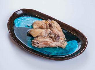 Boiled Chicken Portions Seasoned with Pepper on a Plate side view of japanese food