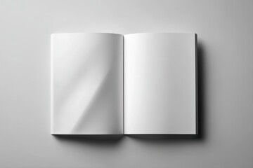 Open blank book on a light gray surface