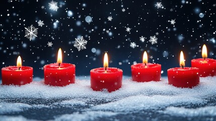 Burning red candles in snowy winter setting