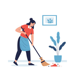 Fototapeta premium A woman is carefully sweeping up dust and debris from the floor in a room with a broom.