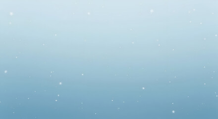 Gentle falling snowflakes on a soft blue gradient background, perfect for winter themes and holiday designs