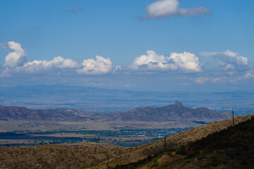 Amazing landmark with settlements and mountains and cloudy sky at Armenia-Georgia state border