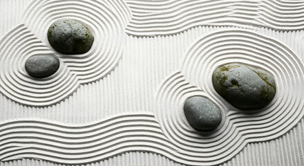 Zen garden with raked sand and smooth stones evokes peace, meditation, and tranquility for relaxation and mindfulness