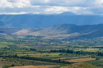 Amazing landmark with settlements and mountains and cloudy sky at Armenia-Georgia state border