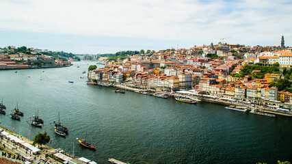 Obraz premium Porto, Portugal - July 10 2025: The picturesque landscape of river shore of Douro River in Portugal