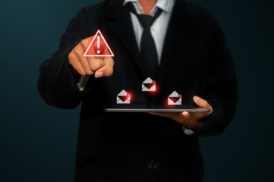Businessman pressing digital warning icons with red alert symbols. Ideal for cybersecurity, error systems, and risk management concepts. - Powered by Adobe
