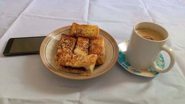 Plate of Toasted Bread with Cup of Coffee Latte