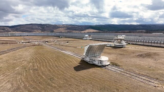 Karachay Cherkessia, Russia - September 12, 2024: A close up top down aerial view of the gigantic circular RATAN 600 radio telescope, focusing on the central receiver structure and the network of radi