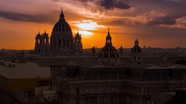 Dramatic sunset silhouetting the domes of paris, france
