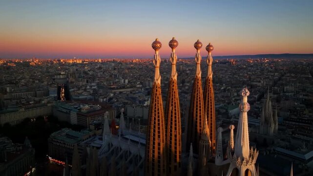 Sagrada familia towers sunset aerial view over barcelona cityscape