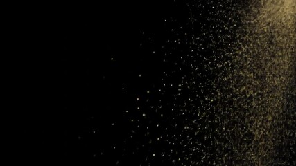 Cinematic shimmering golden particles floating in a slow-motion cloud against a solid black backdrop, creating a magical glitter overlay effect - Powered by Adobe