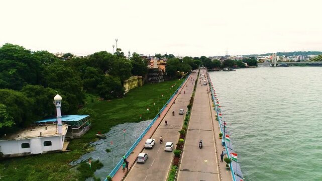 Upper Lake, VIP Road, Bhopal, Madhya Pradesh, India. Aerial drone shot of bhopal capital city of madhya pradesh with upper lake and downtown roads with car traffic in india