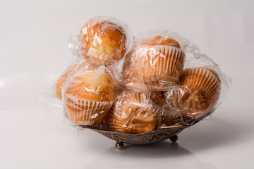 Packaged Spanish Madalena Pastry in Industrial-Style Presentation