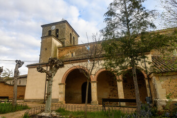 Church of San Juan Evangelista in Oteros de Boedo, Palencia with arched porch and clock tower