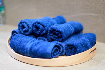 blue towel roll on tray, for spa or exercise
