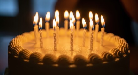 Birthday cake with lit candles close-up