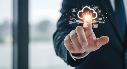 Man in suit pointing at digital cloud icon with glowing center and circuit board connections around it