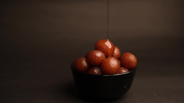 Gulab Jamun, A beloved dessert in Indian and Pakistani cuisine, drenched in sweet syrup