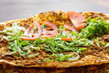 Traditional Turkish dish lahmacun in close-up