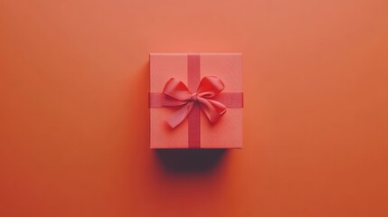 A Coral Gift Box with a Delicate Pink Bow