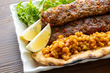 Close-up of traditional Turkish shish kebabs on oval plate