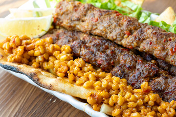 Close-up of traditional Turkish shish kebabs on oval plate