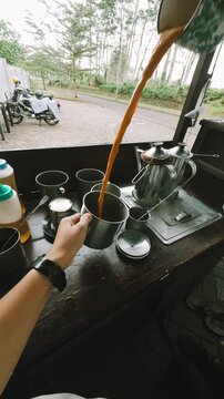 Slow motion POV of Making a Malaysian Teh Tarik