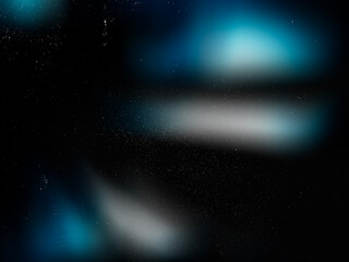 Blue glowing light soft blur with retro grain, scratches, dust and film noise on black vintage surface. Abstract textured overlay for faded retro photo effects. Defocused Blur. Screen Overlay Mode