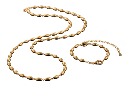 Elegant gold toned necklace and bracelet jewelry set isolated on transparent background