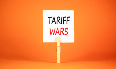Trade tariff wars symbol. Concept word Tariff wars on beautiful white paper. Beautiful wooden...