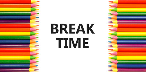 Break time symbol. Concept word Break time on beautiful white paper. Colored pencils. Beautiful white paper background. Business break time concept. Copy space.