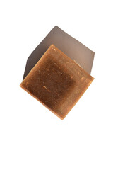square brown piece of natural soap on white background top view