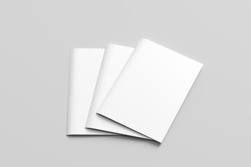 closed blank brochures on grey background, top view. Mock up for design