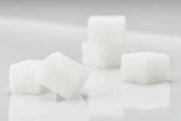 Close-Up of White Sugar Cubes on a Clean White Surface
