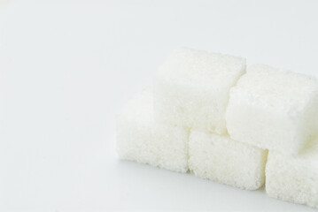 Stack of White Sugar Cubes Isolated Against a Clean Minimal Background