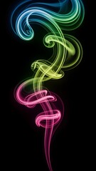 Obraz premium Colorful smoke rising gracefully, against the dark background, creating a visually stunning effect