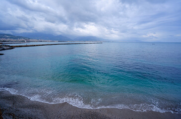 Coastal View of Calm Ocean Waters Under an Overcast Sky