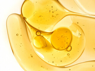 Golden Glow: A Radiant Yellow Texture of Serum Drops, Bubbles, and the Pure Essence of Vitamin C and Hyaluronic Acid
