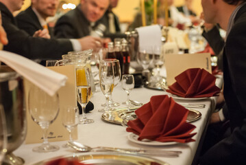 Formal dinner table setting with guests.