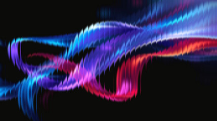 Vibrant abstract flowing ribbons of electric blue, purple, and fiery red ignite against a dark background creating dynamic energy