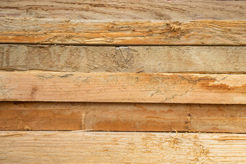 Natural surface of stacked wood timbers. Horizontal view
