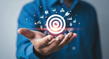 Businessman Holding Digital Target with Business Icons.