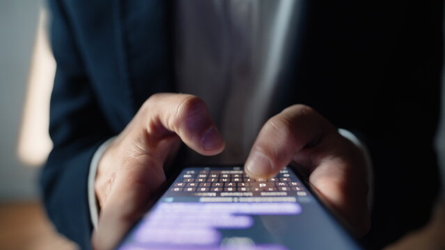 Man hands chatting smartphone online macro closeup. User typing text message