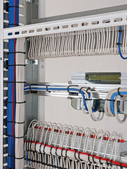Installation of an electrical panel using nylon cable ties.