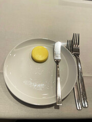 a plate with a butter knife and butter on it