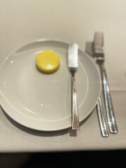 a plate with a butter knife and butter on it