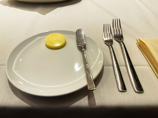a plate with a butter knife and butter on it