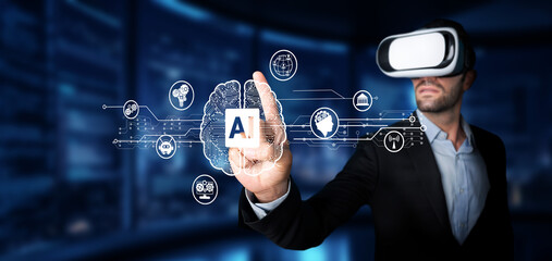 A businessman uses virtual reality to engage with artificial intelligence visualizations. This...